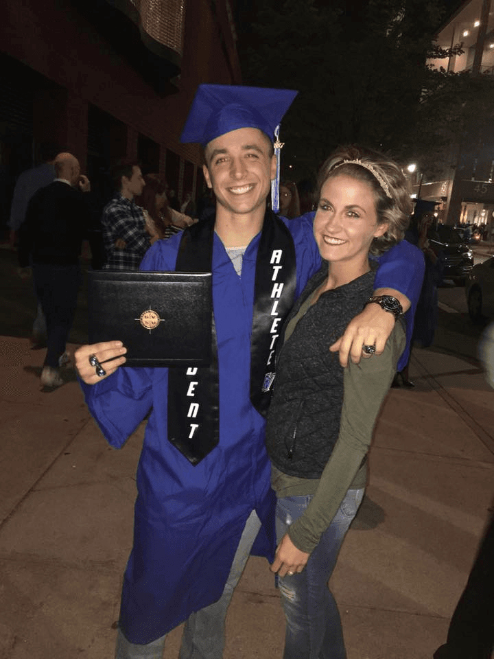Luke Vasilion at GVSU graduation with Student Athlete sash
