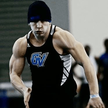 Luke Vasilion sprinting for Grand Valley State University
